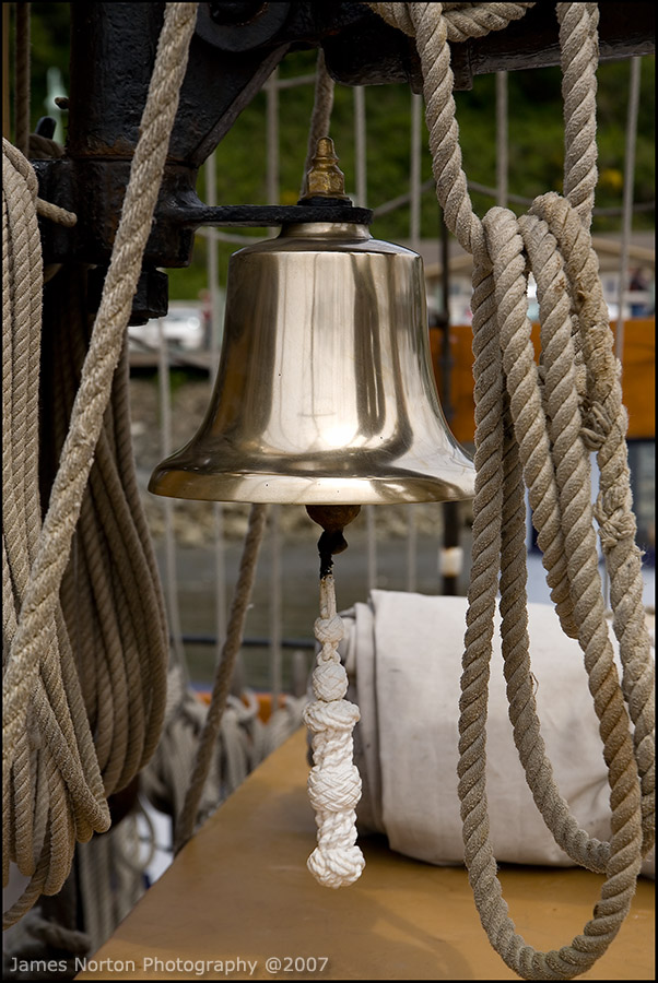 Maritime Bell on Old Wooden Boat
